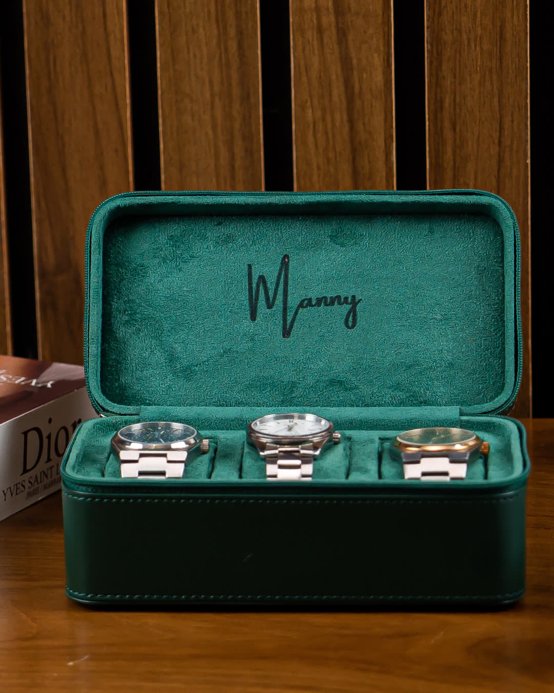The name Manny engraved inside a green LWR 3-slot watch box